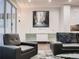 Modern living room featuring comfortable seating, an elegant console, and stylish wall art at 338 Saint Paul St, Denver, CO 80206