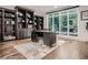 Bright office space with built-in shelving, a large window, and a sleek desk at 338 Saint Paul St, Denver, CO 80206