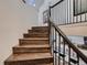 Elegant wood staircase with black metal railings and modern design at 338 Saint Paul St, Denver, CO 80206
