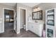 Bathroom with marble countertops, white cabinets and a view to the fireplace at 3603 Soaring Eagle Ct, Castle Rock, CO 80109