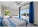 Bright bedroom with a vaulted ceiling, ceiling fan, and large window overlooking the neighborhood at 3603 Soaring Eagle Ct, Castle Rock, CO 80109