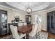 Spacious dining room with modern lighting and ample seating at 3603 Soaring Eagle Ct, Castle Rock, CO 80109