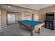 Open concept game room featuring an arcade game, pool table, and surf board wall art at 3603 Soaring Eagle Ct, Castle Rock, CO 80109