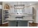 Bright kitchen features stainless steel appliances, granite counters, island with seating, and pendant lighting at 3603 Soaring Eagle Ct, Castle Rock, CO 80109