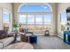 Bright living room featuring a large arch window overlooking a beautiful landscape at 3603 Soaring Eagle Ct, Castle Rock, CO 80109