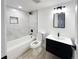 Updated bathroom with marble-look tile and modern vanity at 4899 S Dudley # 1I, Littleton, CO 80123