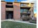 Brick building exterior with stairs leading to individual condo units at 4899 S Dudley # 1I, Littleton, CO 80123