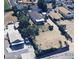 Overhead view showcases the property's layout, with mature trees and proximity to surrounding amenities and roads at 5660 Olive St, Commerce City, CO 80022