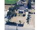 An aerial view of the property featuring landscaping, a large lot, and surrounding neighborhood at 5660 Olive St, Commerce City, CO 80022