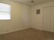 Cozy bedroom with neutral walls, carpet flooring, and a window that allows for plenty of natural light at 5660 Olive St, Commerce City, CO 80022