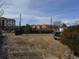 Expansive lot with plenty of space for parking, gardening, or future expansion at 5660 Olive St, Commerce City, CO 80022