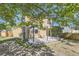 Backyard with deck, pergola, mature trees, wood fence, and patio at 12616 Country Meadows Dr, Parker, CO 80134