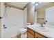 Bathroom featuring tub and shower combination, vanity with white countertop at 12616 Country Meadows Dr, Parker, CO 80134