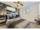 Staged bedroom with window, wallpaper, carpet and ceiling fan at 12616 Country Meadows Dr, Parker, CO 80134