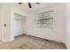 Bright bedroom with plush carpeting, neutral walls, window and closet at 12616 Country Meadows Dr, Parker, CO 80134