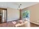 Open dining area features wood floors, modern light fixture, and sliding glass door to the outside at 12616 Country Meadows Dr, Parker, CO 80134