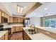 Functional kitchen featuring stainless steel appliances, oak cabinets, and ample counter space at 12616 Country Meadows Dr, Parker, CO 80134