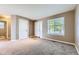 Cozy living room with plush carpet, a bright window, and a neutral color palette at 12616 Country Meadows Dr, Parker, CO 80134
