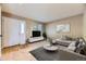Modern living room featuring neutral tones, plush seating, and a bright, airy atmosphere at 12616 Country Meadows Dr, Parker, CO 80134