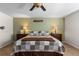 Spacious bedroom features a large bed, soft lighting, and decorative wall art at 8104 El Jebel Loop, Castle Rock, CO 80108