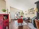 Inviting living area with a stylish seating arrangement, decor, and a fireplace at 4453 S Pagosa Way, Aurora, CO 80015