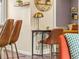 Comfortable study featuring a table, chair, and decorative shelf against a neutral wall at 4453 S Pagosa Way, Aurora, CO 80015
