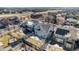 An aerial view showcases this home, its solar panels, and a backyard with trampoline in a Gathering-friendly neighborhood at 11712 Lewiston St, Commerce City, CO 80022
