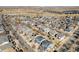 An aerial view captures this residential neighborhood, featuring neatly arranged houses, manicured lawns, and inviting streets at 11712 Lewiston St, Commerce City, CO 80022