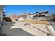 Spacious fenced backyard featuring a large patio, perfect for outdoor entertaining and activities at 11712 Lewiston St, Commerce City, CO 80022