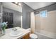 Bathroom features a single sink, tiled walls, and a shower/tub combination at 11712 Lewiston St, Commerce City, CO 80022