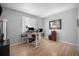 Bright bedroom with hardwood floors offers ample space and natural light for a home office at 11712 Lewiston St, Commerce City, CO 80022