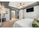 Spacious primary bedroom with carpet, en-suite bath, and adjacent sitting area at 11712 Lewiston St, Commerce City, CO 80022