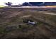 Stunning aerial view of property with distant sunset at 3487 Willownook Ranch Trl, Elizabeth, CO 80107