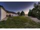 Backyard with patio and mature trees at 3487 Willownook Ranch Trl, Elizabeth, CO 80107