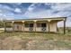 Horse barn featuring individual stalls with overhead cover on a sunny day at 3487 Willownook Ranch Trl, Elizabeth, CO 80107
