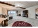 Finished basement with plush seating, and a sliding glass door offering natural light and views at 3487 Willownook Ranch Trl, Elizabeth, CO 80107