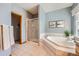 Luxurious bathroom with a jetted tub, a separate shower, and tasteful decorative accents at 3487 Willownook Ranch Trl, Elizabeth, CO 80107