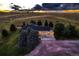 Aerial view of home with three-car garage and dramatic sunset at 3487 Willownook Ranch Trl, Elizabeth, CO 80107