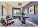 Comfortable home office with large windows offering scenic views and a modern, rustic design at 3487 Willownook Ranch Trl, Elizabeth, CO 80107
