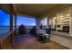 Relaxing covered porch with a rocking chair overlooking beautiful pasture land at 3487 Willownook Ranch Trl, Elizabeth, CO 80107