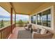 Comfortable porch with seating offering a relaxing place to enjoy the open views at 3487 Willownook Ranch Trl, Elizabeth, CO 80107