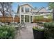 Inviting backyard with ample seating, a large umbrella, and lush landscaping at 4508 Lowell Blvd, Denver, CO 80211