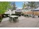 Spacious backyard patio with dining table, umbrella, and comfortable seating arrangement at 4508 Lowell Blvd, Denver, CO 80211
