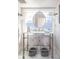 Charming bathroom featuring a console sink, vintage style lighting and a window providing natural light at 4508 Lowell Blvd, Denver, CO 80211