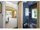 Charming Bedroom with a blue accent wall and view into main bedroom at 4508 Lowell Blvd, Denver, CO 80211