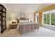 Bright bedroom showcases a large window, natural light, and decor at 4508 Lowell Blvd, Denver, CO 80211