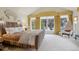 Sunny bedroom featuring vaulted ceiling, large windows and stylish decor at 4508 Lowell Blvd, Denver, CO 80211