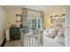 Stylish bedroom featuring a crib, built-in shelving, and comfortable beanbag chairs at 4508 Lowell Blvd, Denver, CO 80211