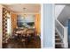 Beautiful dining room with a large round table, patterned wallpaper, and hardwood floors at 4508 Lowell Blvd, Denver, CO 80211