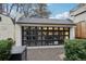 Detached garage featuring a modern glass-paneled door for a sleek look at 4508 Lowell Blvd, Denver, CO 80211